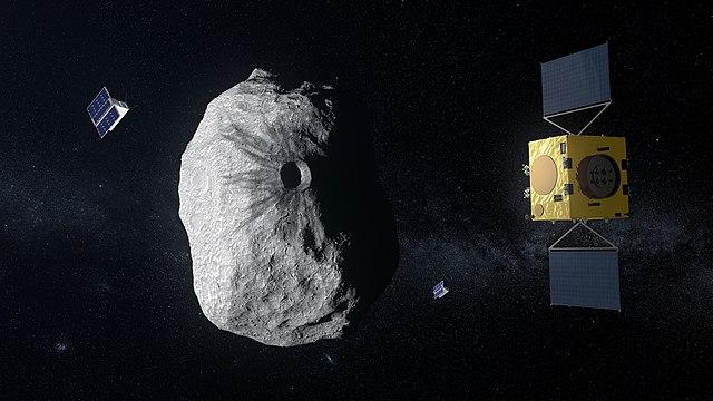 הדמיית אמן של הגשושית הֶרָה מתקרבת לאסטרואיד ה"פצוע" דימורפוס. משימות חלל אירופיות שמשוגרות כיום מנמל החלל קייפ קנוורל שבפלורידה. קרדיט: ESA